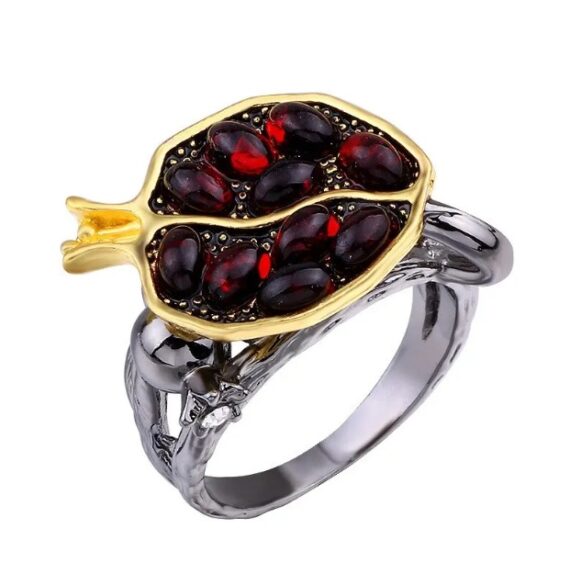 Close-up of Aphrodite Pomegranate Ring with red crystals