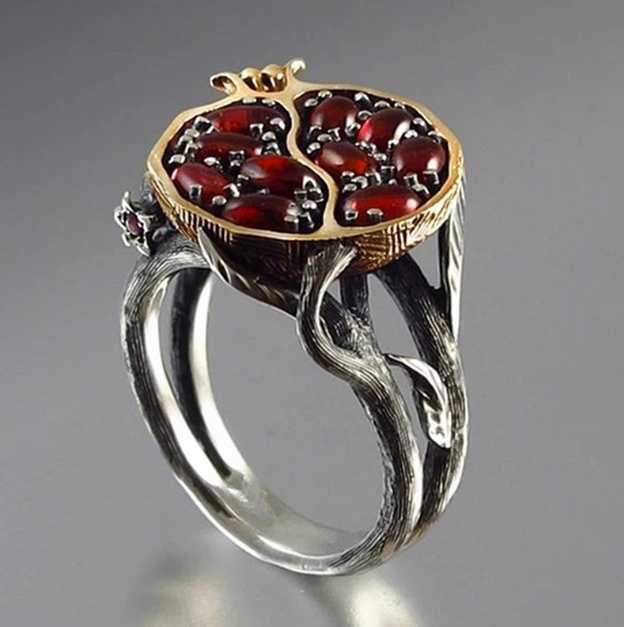 Side view of vintage gold and silver Aphrodite Pomegranate Ring