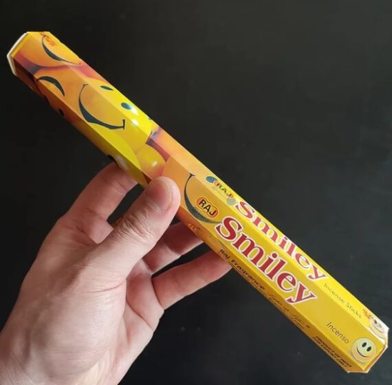 Smiley: A cheerful yellow smiley face beaming with joy, accompanied by the label "Smiley Incense" in playful lettering.